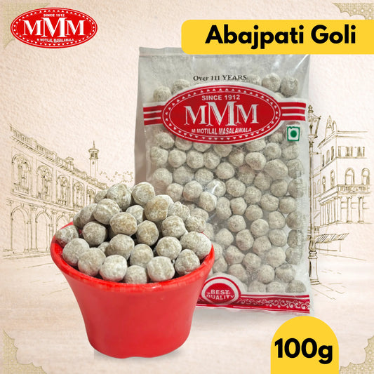 Packaged Abajpati Goli with a bowl of the product and MMM logo on a decorative background