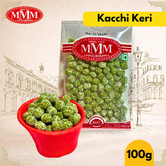 Packaged kacchi keri with MMM branding and a red bowl filled with candies on a decorative background.