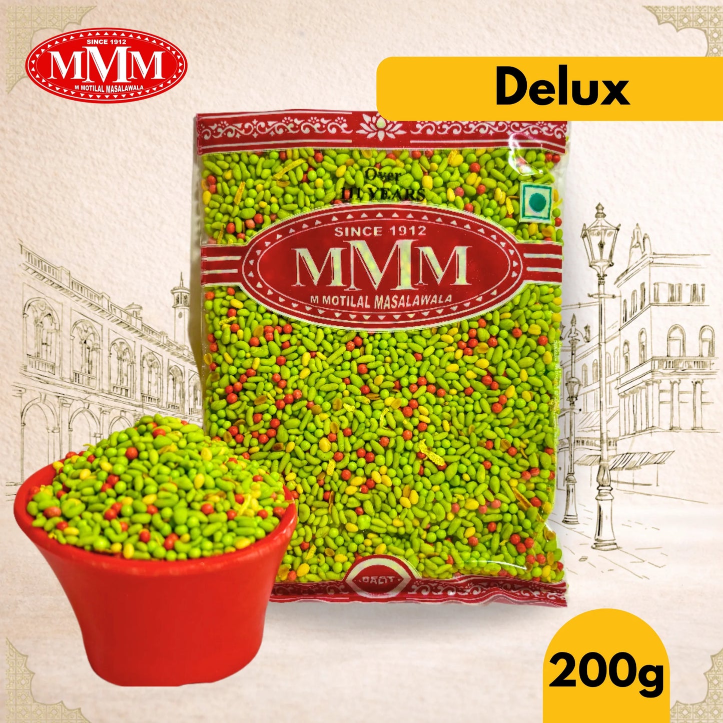 MMM Delux packet of green colored mukhwas with a small bowl filled with spices on a decorative background.
