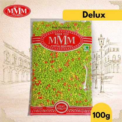 Packaged delux mukhwas with MMM logo and 'Delux' label on a decorative background